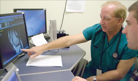 Dr. Paul Gochis, Chief of Staff at St. Luke, works with Dr. Ben Grass, the first Family Medicine Residency of Western Montana resident to complete a three-week rotation at St. Luke Community Healthcare in Ronan.