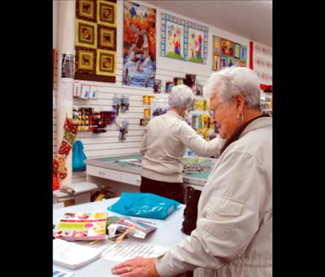 Shopper Dolores Swalling visits All In Stitches quilt and knitting store during Small Business Saturday in Polson. 