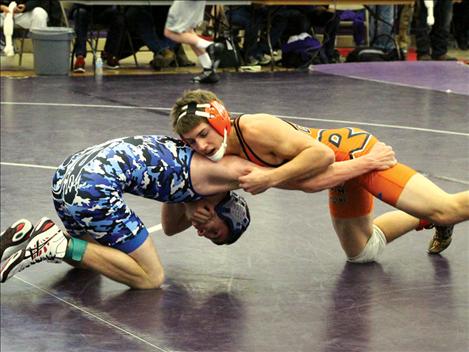 Ronan’s Connor Benn, right, wrestles Saturday at the first invitational wrestling meet held Saturday in Polson.