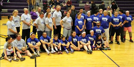 Teams from Mountain West Co-op, right, and Farmers/Ranchers competed in a playful game of basketball to raise funds for St. Ignatius coach Les Rice.