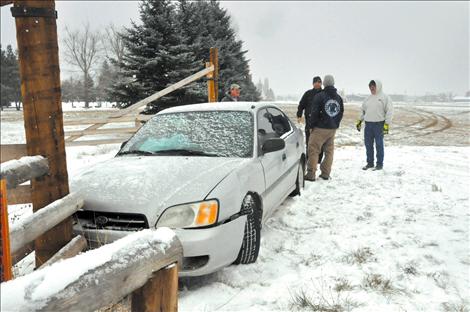 A car crashed into a residential fence across from Total Home in Ronan after its driver tried to avoid hitting slower cars. The incident was one of many on Lake County roadways Monday. 