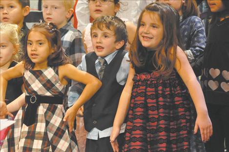 Strange faces and body language accompanied a performance of “Wacky Old St. Nicholas,” which Mrs. Lloyd’s class provided instrumental accompainment in K.William Harvey’s Christmas Carol-Along.   