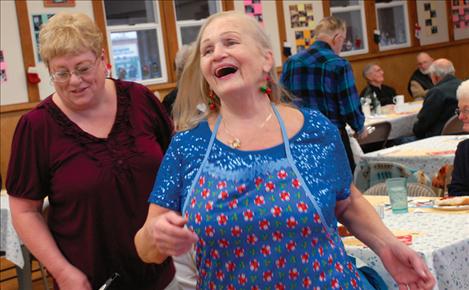 Patsy Orr laughs with a lunch guest at the Polson Indian Senior Citizen Center.