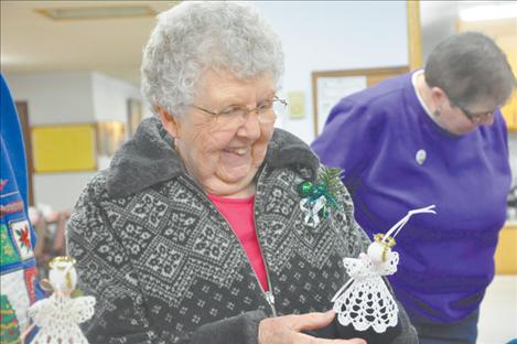 Joyce Town smiles after receiving an angel crocheted by Doris Snyder of  St. Ignatius. 