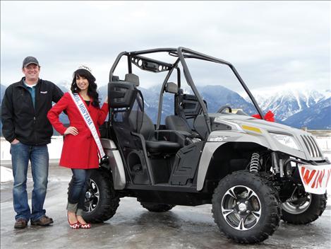 Mrs. Montana Alyssa Schock stands with Engblom and his new prize. Engblom also won a 10-foot aluminum trailer with ramp as part of the raffle.