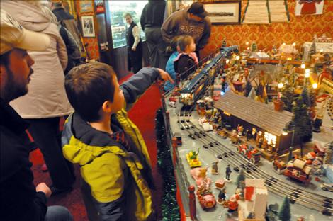 Oliver Rowe points to a monorail model train at the second annual “Running of the Toy Trains” held at Four Winds Trading Post. 