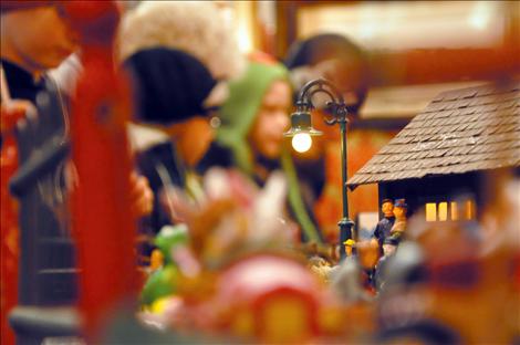 The tiny village captures the attention of youngsters with its Santas, replica cars and railroad signals that lift up and down.