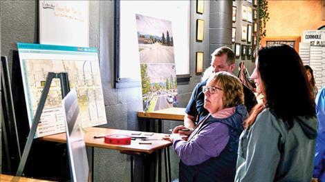 Citizens leave feedback on sticky notes about plans for downtown at the Ronan Cooperative Brewery.