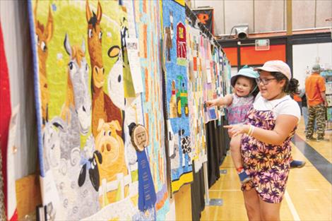 Community members view quilts on display at the Ronan High School during the  Mission Mountain Quilt Guild’s 31st annual quilt show held June 8-9.