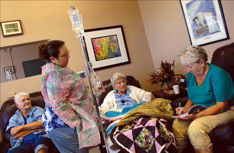 RN Kathie Folts works with patients at the oncology clinic at Providence St. Joseph Medical Center.