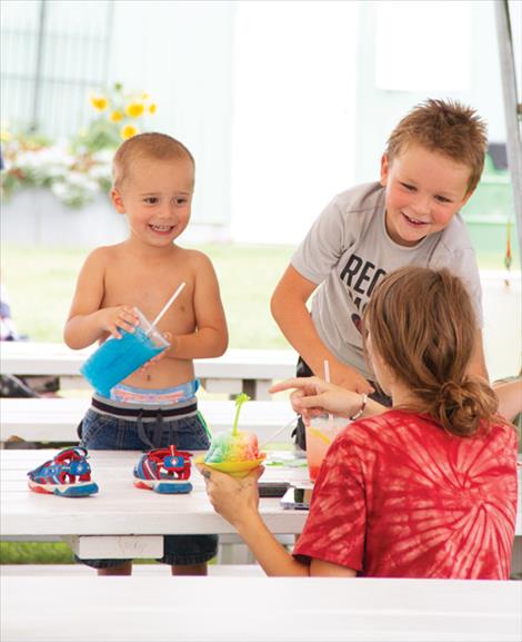 kids enjoy cool treats on a hot day at the fair