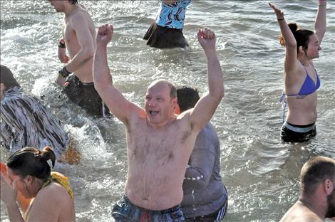 Gary Collinge yells in victory after completing the polar plunge. 