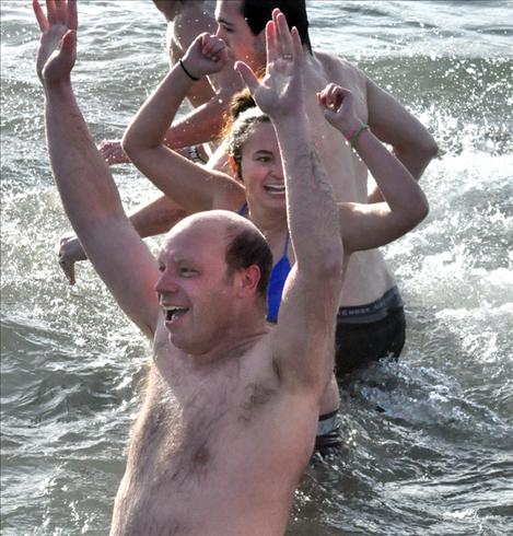 Gary Collinge yells in victory after completing the polar plunge. 