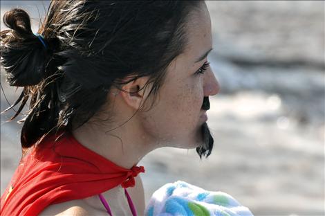 Monica Cleveland emerges from the polar plunge with a soaked beard and cape.