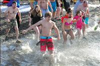 People brave icy waters in New Year's Polar Plunge