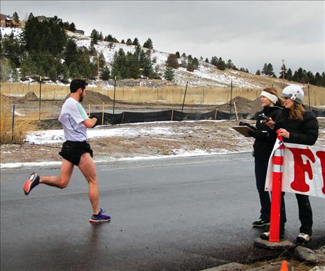 Jason Delaney nears the finish line of Polson Running’s “Sorry ‘Bout That” half-maration. Delaney was the first runner to complete the course, boasting a winning time of 1:13:33. 