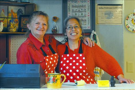 Ofelia Folsom, left, and Lisa Fredlund are constantly laughing as they cook and greet customers at La Cocina De Esperanza. 