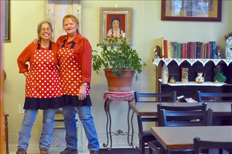 Ofelia Folsom, left, and Lisa Fredlund are constantly laughing as they cook and greet customers at La Cocina De Esperanza. 