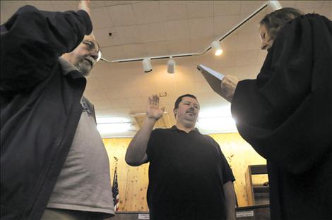 Roger Lemon, left, and Daren Incashola are sworn in as councilmembers for the St. Ignatius Town Council.