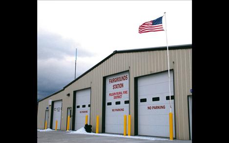 Old Glory snaps over the Fairgrounds Fire Station on Regatta Road in Polson.