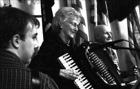 Young accordion player Scott Drake, far left, jams with other accordionists and Ralph Salomon playing the drum. 