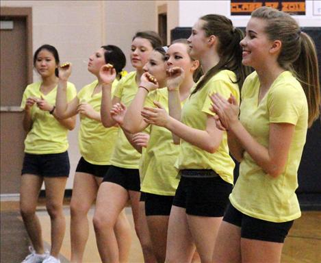 Ronan cheerleaders dressed in yellow t-shirts in support of Head Coach Shelly Buhr's neice, who is fighting cancer.