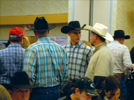 Western Montana livestock producers wait in line for dinner.