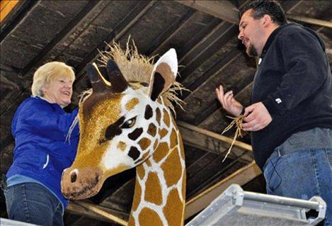 Jane Patterson fashions a giraffe’s mane for the Asset Management float at the 2014 Tournament of Roses Parade. 