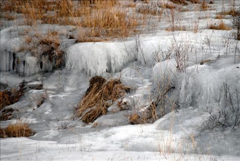 On North Foothills Drive in Ronan, December rains melted several inches of snow, causing water runoff in a field that froze once temperatures dipped again.