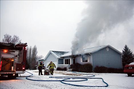 Smoke pours from a duplex on Hillcrest Drive in Polson on the morning of Jan. 23.