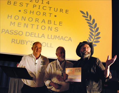 Filmmaker Gary Henderson, right, accepts an award at the Flathead Lake International  CineFest.