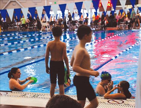 Swimmers and spectators fill the new Mission Valley Aquatic Center, which opened just last summer.