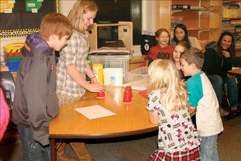 Denny Nelson-Sween and Mandy Couture got the idea to play a game of trickery from the book “The Wildcat and Coyote.” The idea was to guess which cup the object was hiding under.