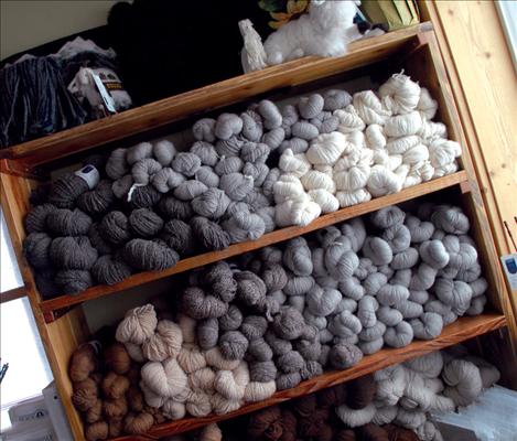 Skeins of smooth alpaca fiber await sale.