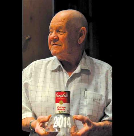 Dale Jackson holds the Soup-er Bowl trophy. 