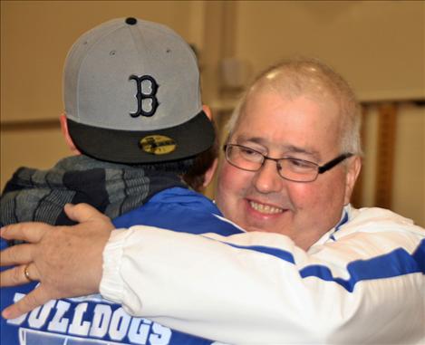 People lined up to hug local coaching legend Les Rice who has logged 34 years of coaching history.