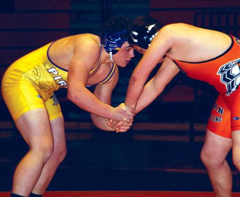 Polson Pirate Mike Corrigan, left, took first place in his 195 weight class at  the Northwestern A Divisional Wrestling Tournament held last weekend in Libby.