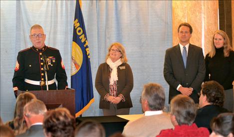 Governor Steve Bullock and First Lady Lisa Bullock, far right, honored Sgt. Chuck Lewis of Walking for the Fallen on Friday with a ServeMontana award. 