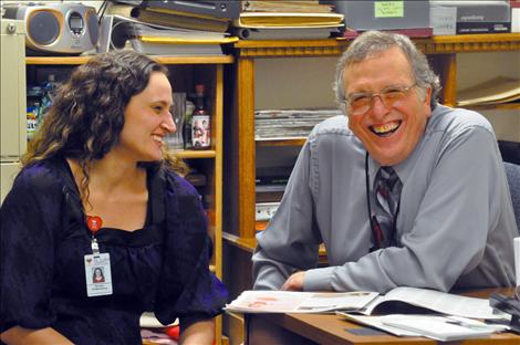 Brooke Roberts visits with Wayne Fuchs in his office at St. Luke Community Hospital. 