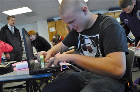 Rocco Santorno works on his math-riddled love poem to a friend.