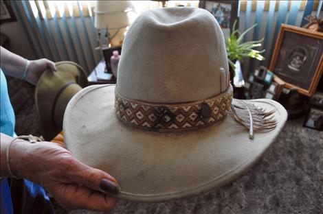 Janice Couture holds a hat that belonged to Leland “Jimi” Hewankorn, who died a month before the Diocese of Helena apologized for sexual abuse of minors who attended the Ursuline Academy in St. Ignatius. 