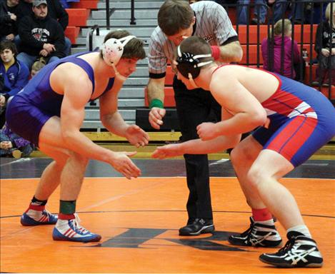 Jacen Petersen of Mission-Charlo’s wrestling team won his second State title last weekend in Billings, capping off two undefeated seasons. Above, Petersen, left, wrestles in the divisional tourney in Ronan.