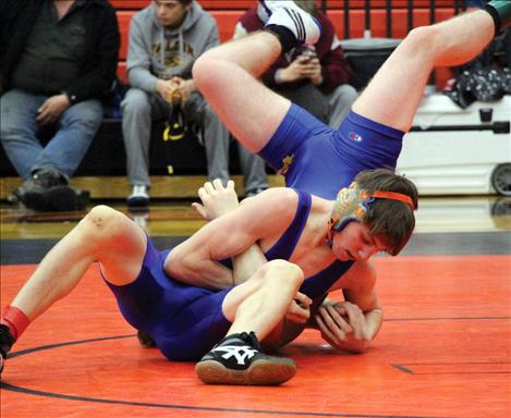 Mission’s Jamie Mullins wrestles at the Divisional Tournament in Ronan before placing 3rd at State.