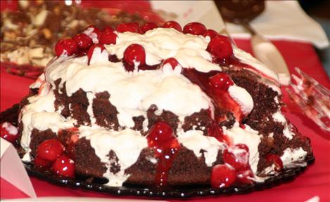 A chocolate cake decorated with cherries was a hit at the festival.