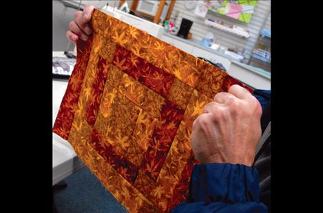 Rocky Stanley shows a piece from a new quilt he’s piecing.