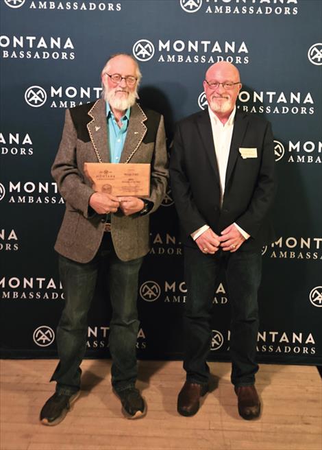 Frank Tyro, left, was presented the Motnana Ambassadors “Educator of the Year” award by his nephew, Ambassador Paddy Fleming, right.
