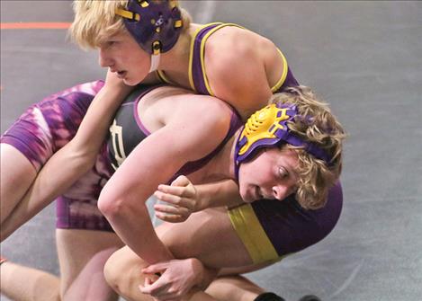 Polson Pirate wrestler Koal Wardall wraps his arms around his opponent’s leg.