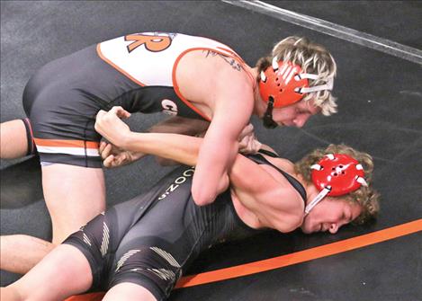 A Ronan Chief wrestler gets the upper hand on his Hamilton Bronc opponent during the Jan. 3 contest. The chiefs finished second on the day at their home-hosted meet with a total of 120.5 points.
