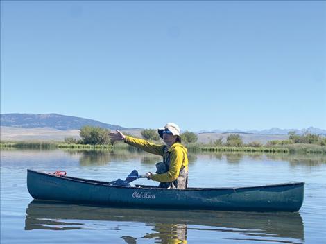 UM Professor Thomas Riecke directs boats during the annual banding drive at Red Rock Lakes National Wildlife Refuge. 