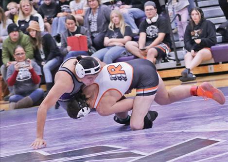 A Ronan Chief wrestler takes down his opponent in the 215 weight category.